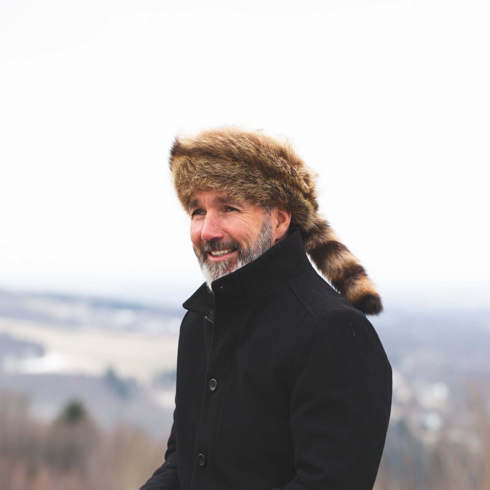 Man with Davy Crockett coonskin hat with real raccoon tail