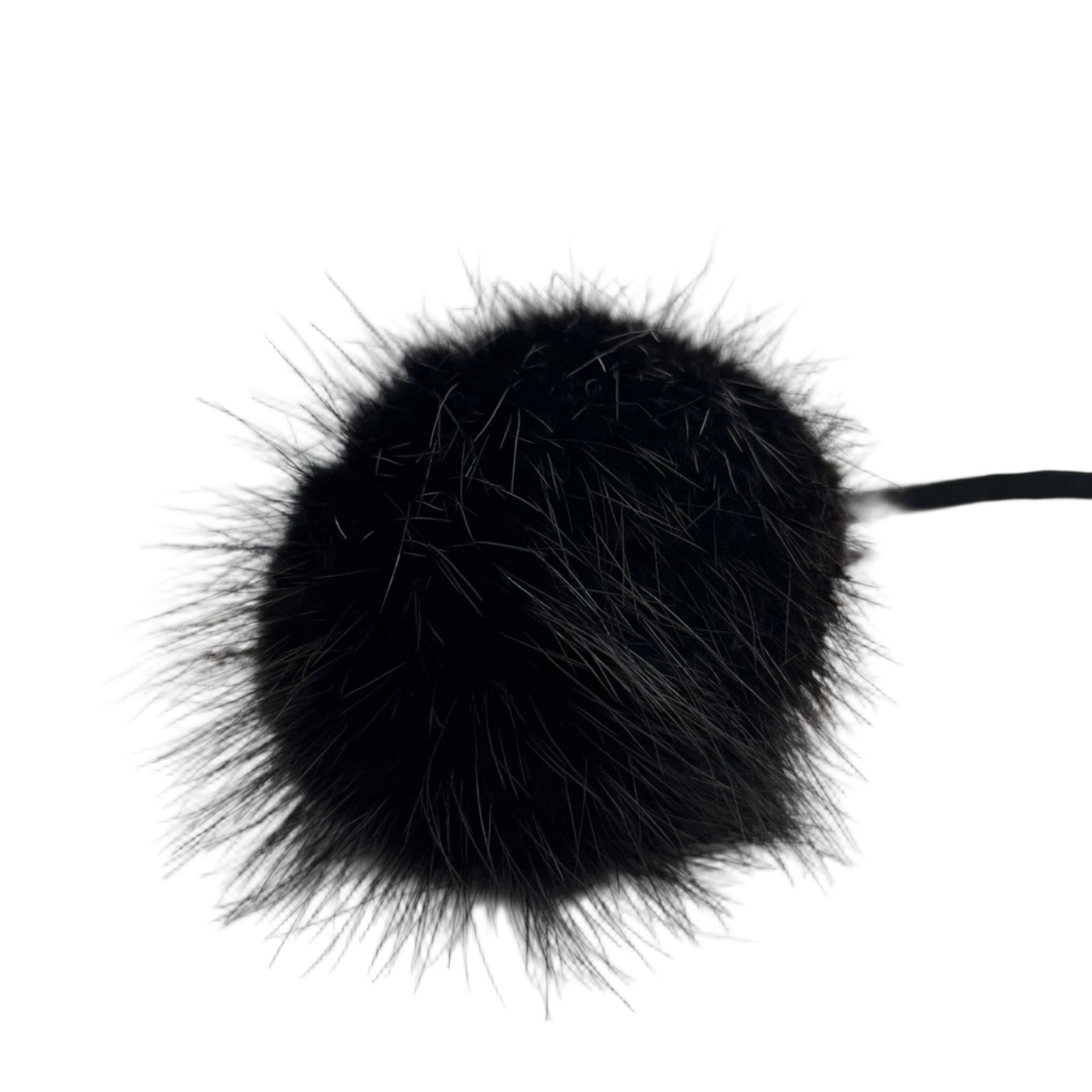 Genuine black mink fur pom-pom with leather tie strap. Handmade in Quebec. Sleek, soft, and timeless accessory for beanies, hoods, and bags.