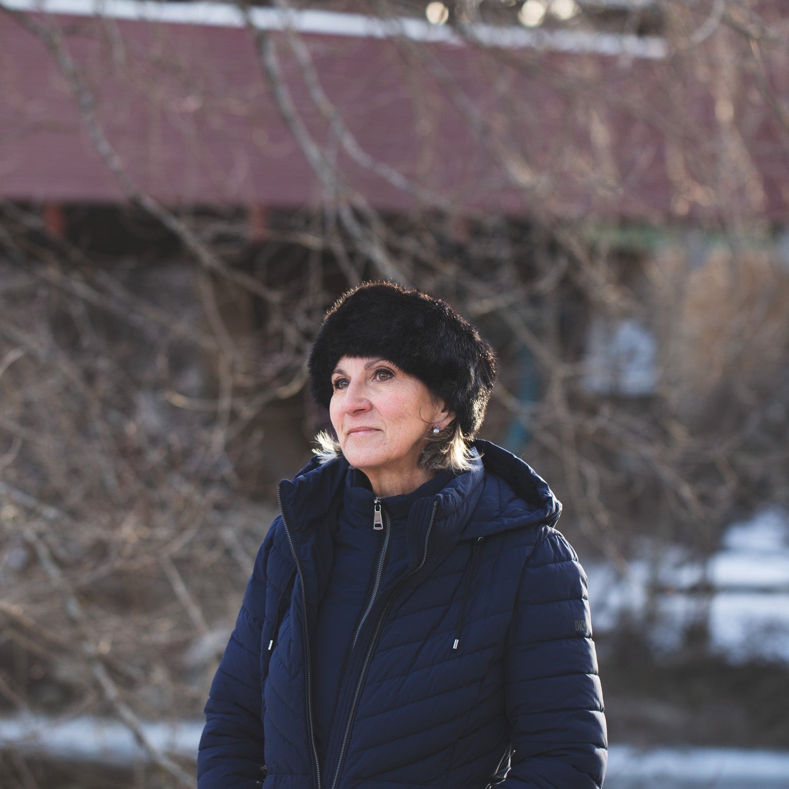 Women with a black real fur hat and leather