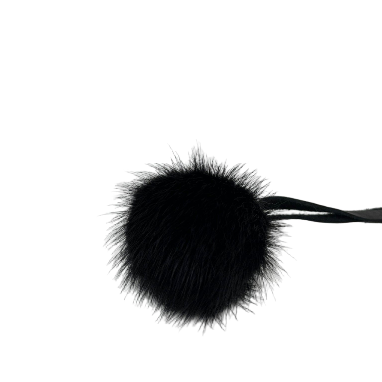 Genuine black mink fur pom-pom with leather tie strap. Handmade in Quebec. Sleek, soft, and timeless accessory for beanies, hoods, and bags.