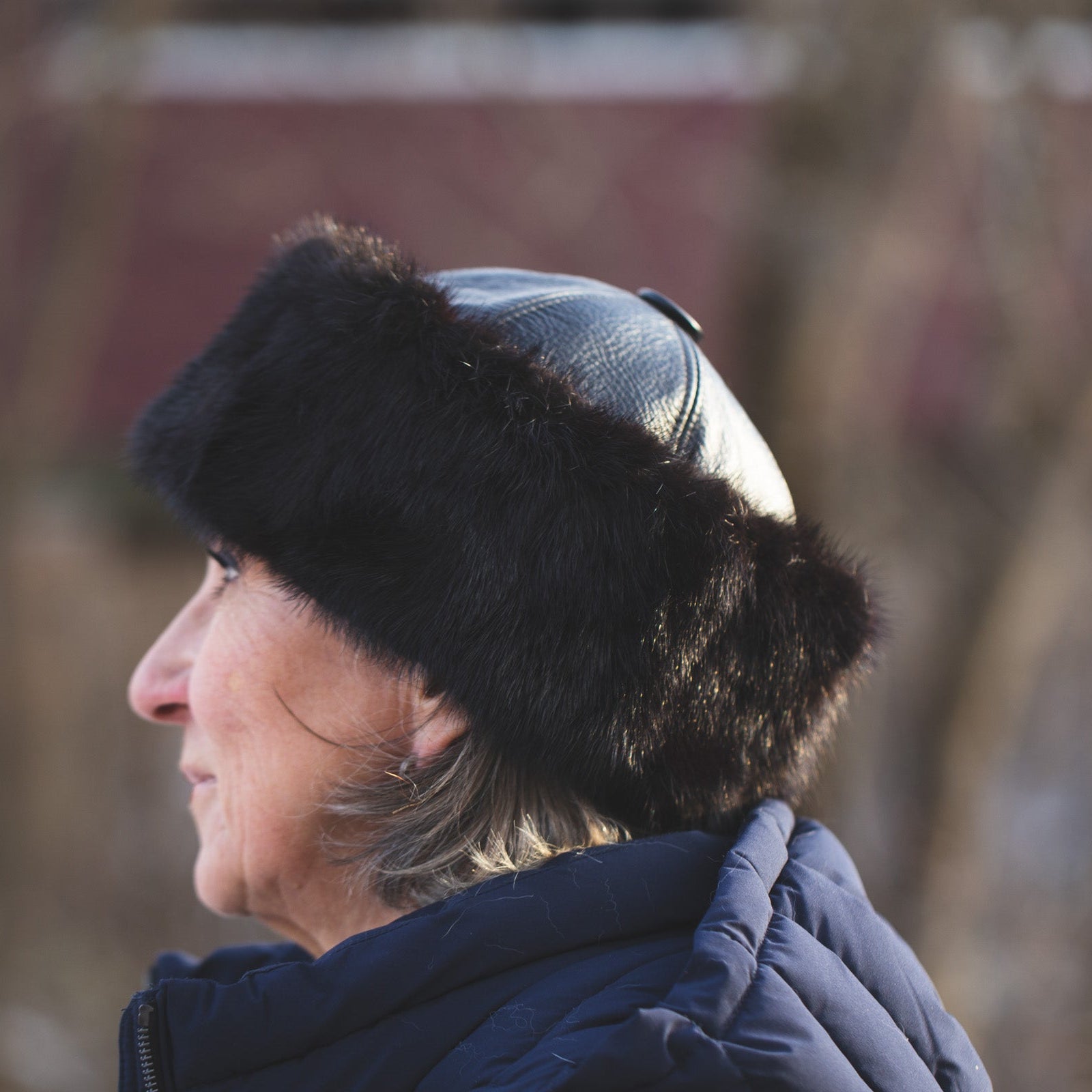 Women with a black real fur hat and leather