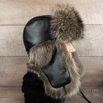 Fur and black leather trapper hat