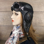 black leather pilot hat and goggles
